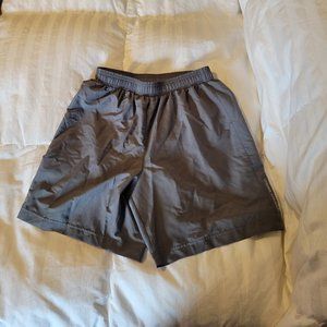 Under Armour heat gear fitted lined running shorts. Size S
